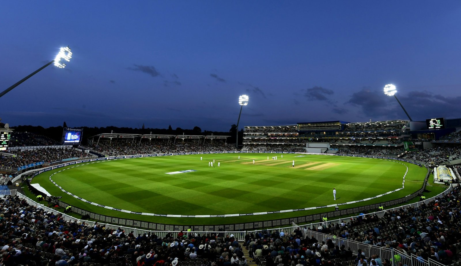 Cricket ground and stands illuminated for an evening match